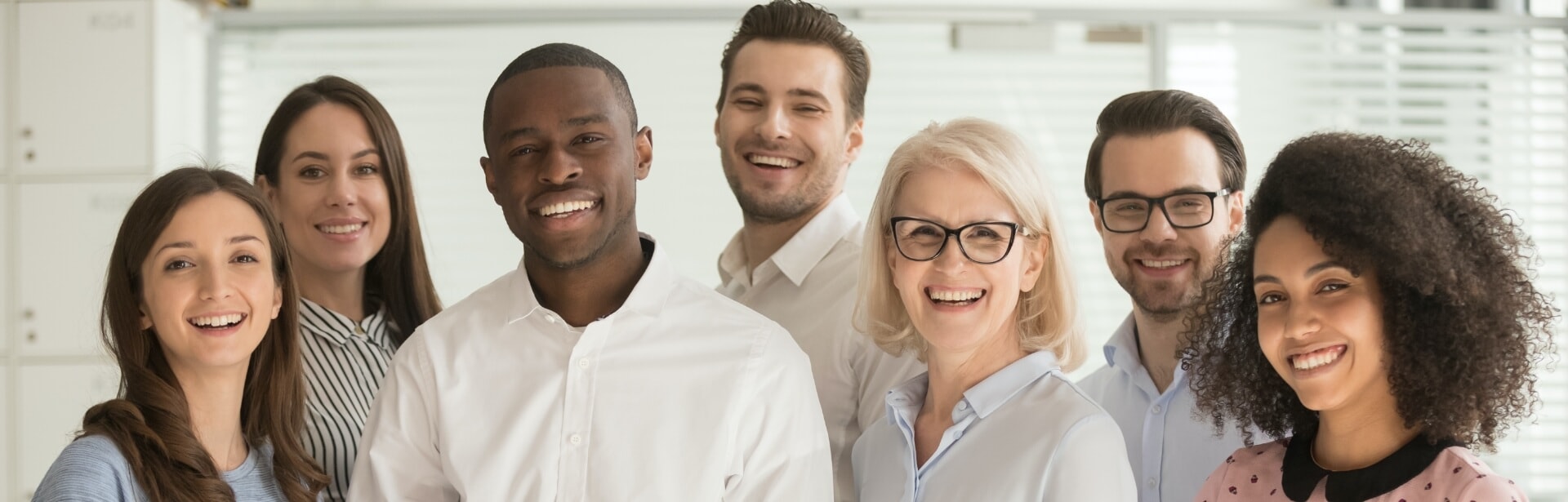 The smiling Prince Albert Dental Clinic team standing together