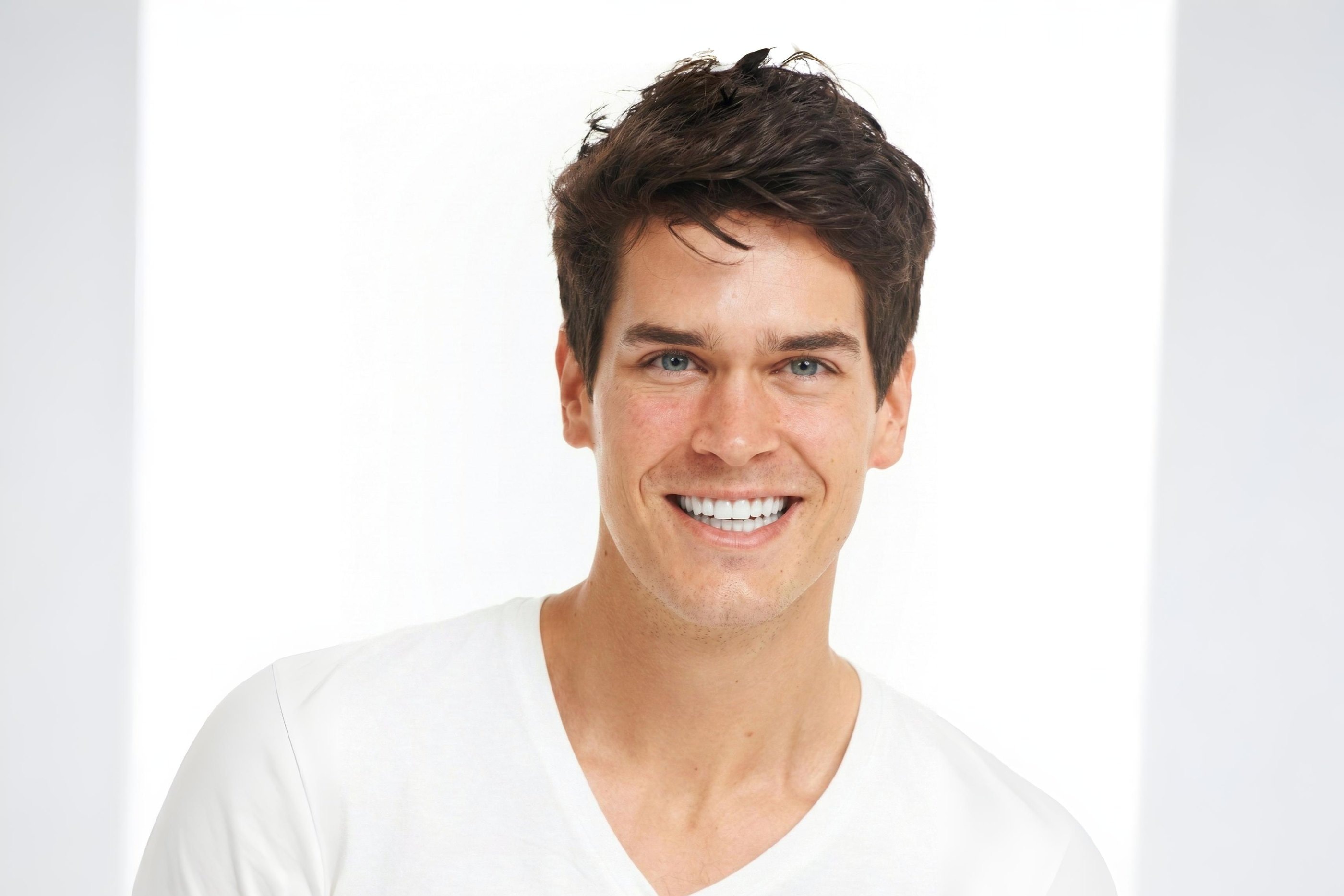 A young man with a bright, healthy smile
